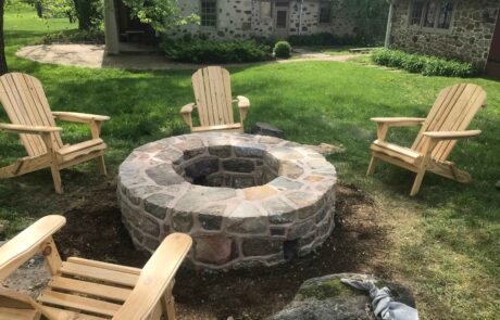 stone fire pit with chairs