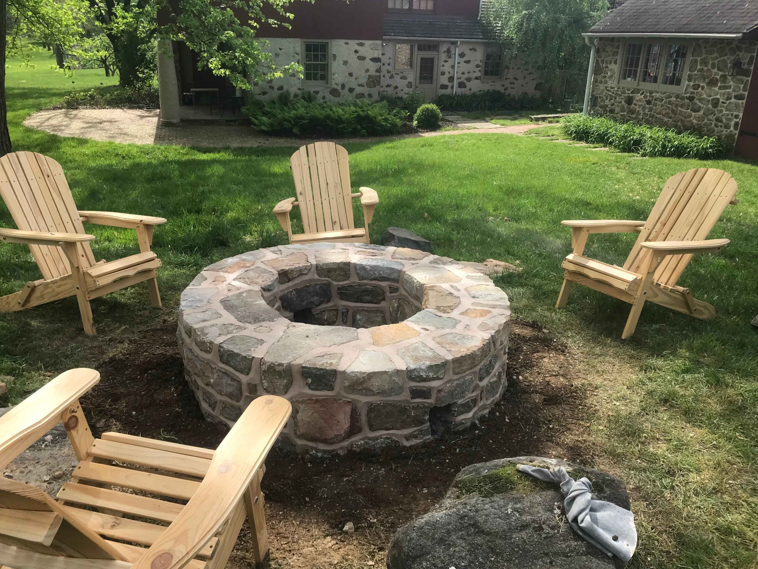 stone fire pit with chairs