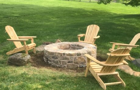 stone fire pit with chairs