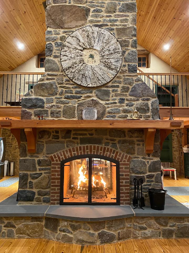 stone fireplace with stone circle embeded