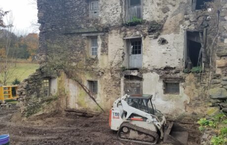 stone wall with bulldozer