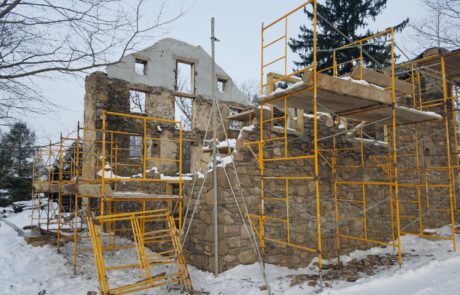 scaffolding at stone building in winter