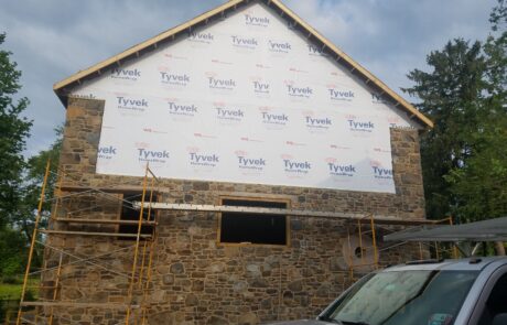 home wrap on stone building