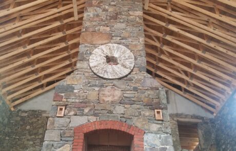 joists above stone fireplace