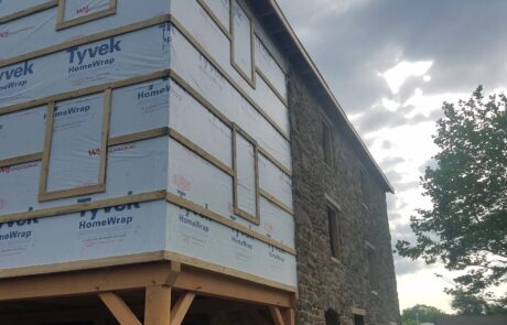 home wrap on stone building