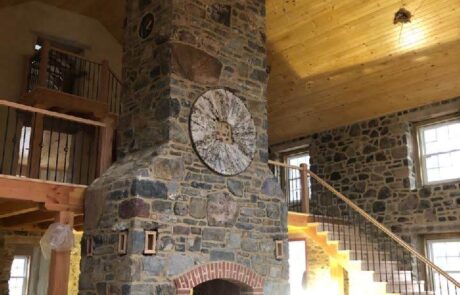 stone fireplace with decorative circle embedded